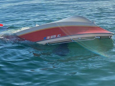 USCG rescue capsized boat crew after flares are fired