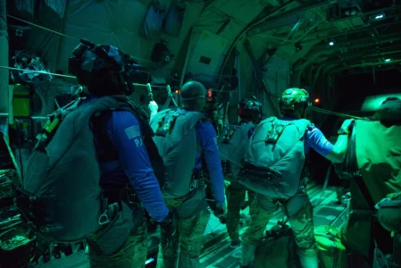Parachuters use flares in nighttime medical mission