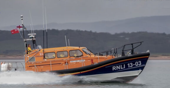 Flares aid nighttime rescue of trawler