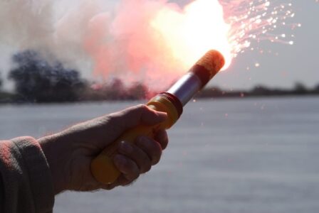 Crew of sinking vessel rescued after firing flare